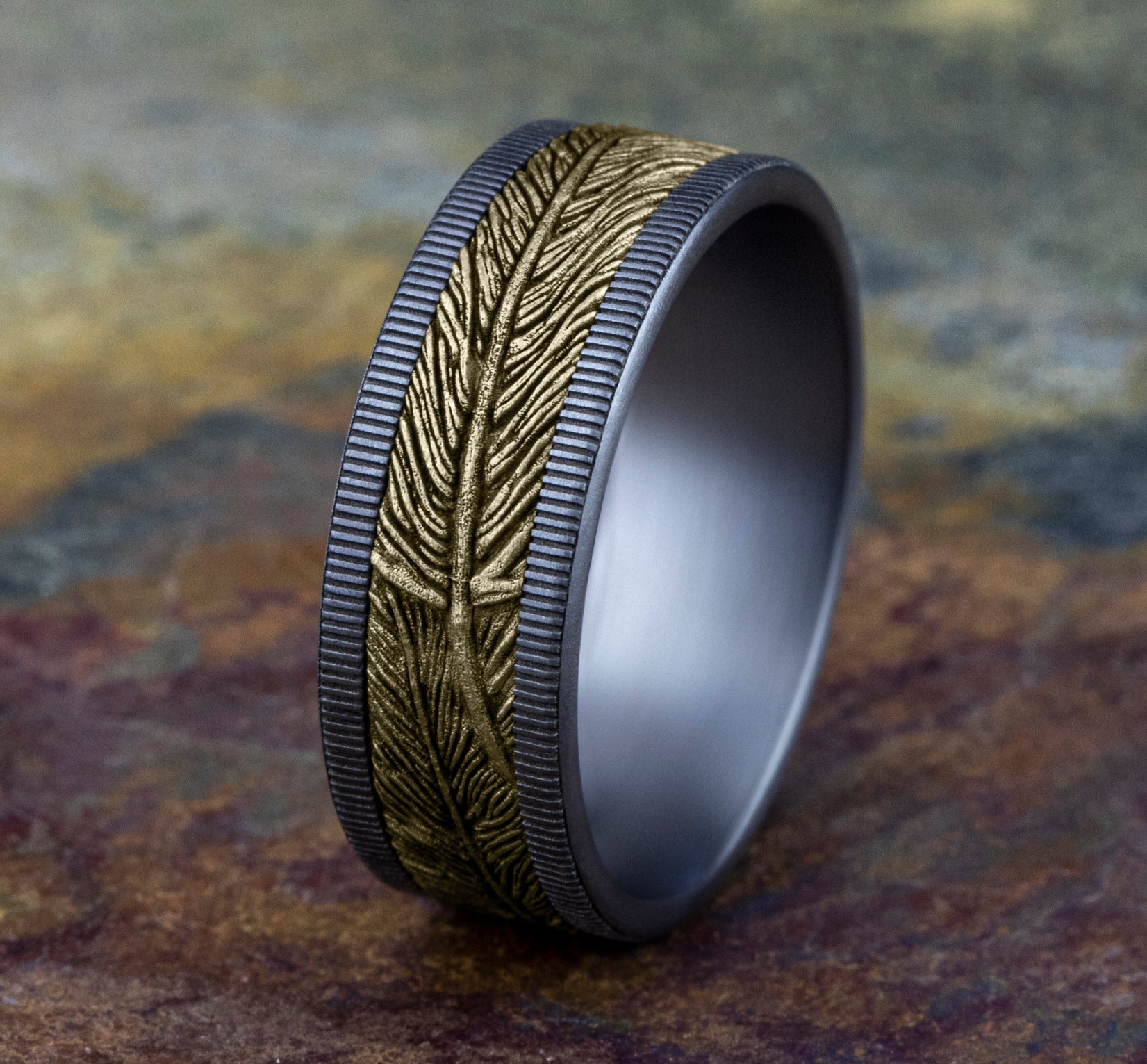 The Kestrel 8mm, Comfort fit, Grey Tantalum and 14K Yellow Gold, Feather patterned center with milgrain detail