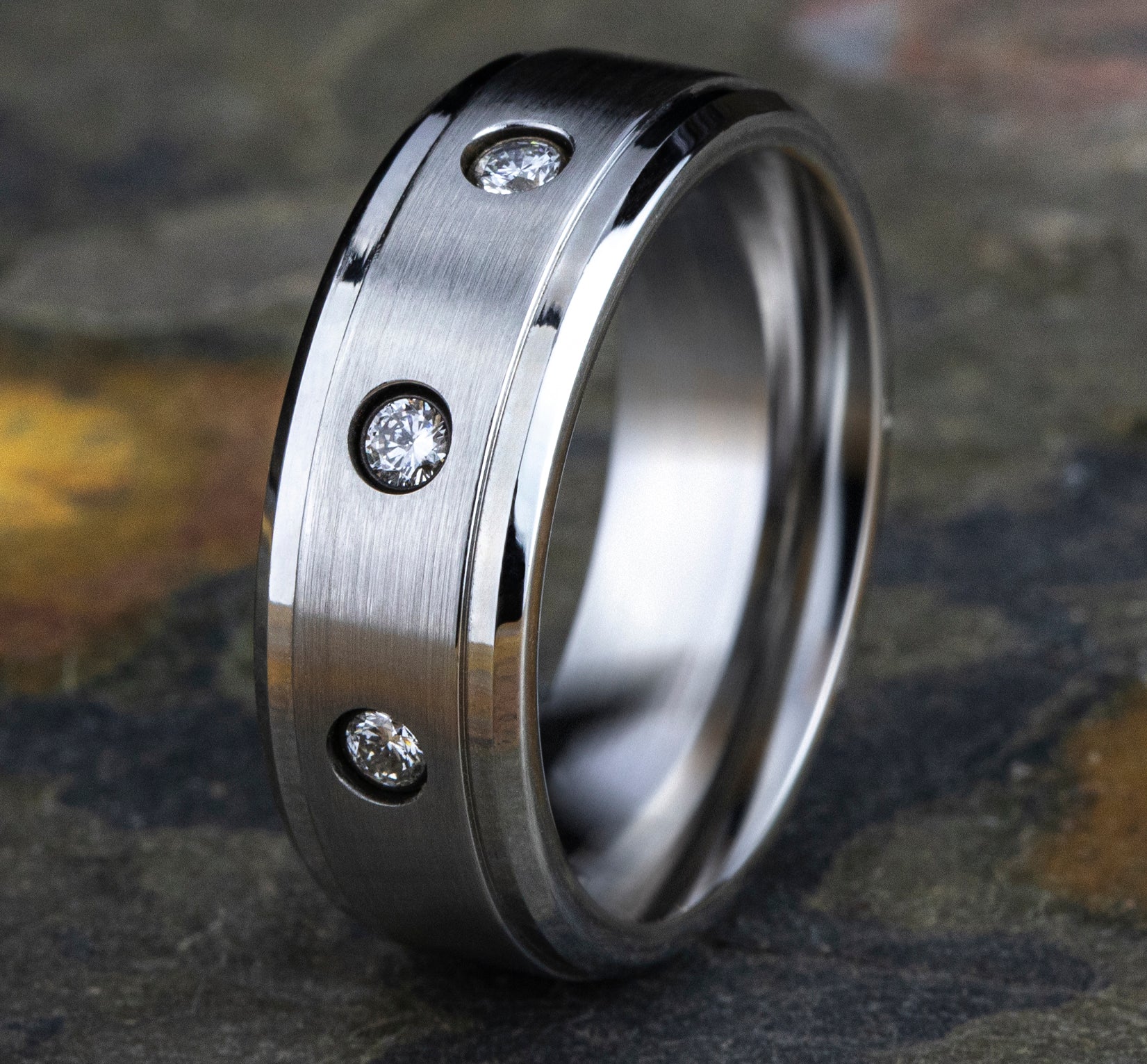 THE CARTER 8mm, Comfort fit, White Cobalt, Satin finish center, polished bevel edges, 3 burnish set diamonds , Carat weight is .18ct, Clarity SI1-2, Color GH