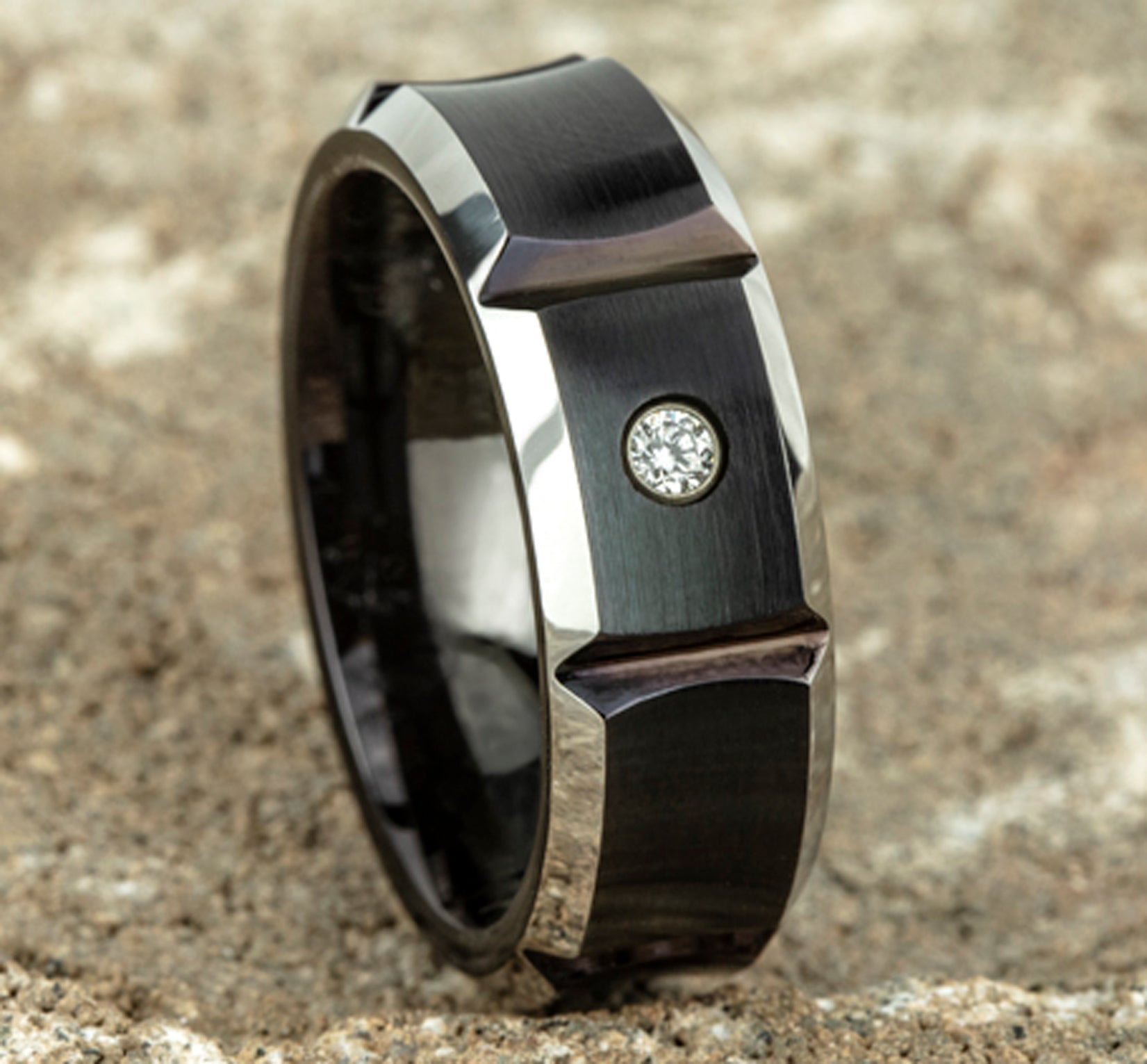 THE DUEL 8mm, Comfort fit, Black Cobalt, Satin finish with deep segmented cuts, 1 burnish set diamond, Carat weight is .06ct, Clarity SI1-2, Color GH
