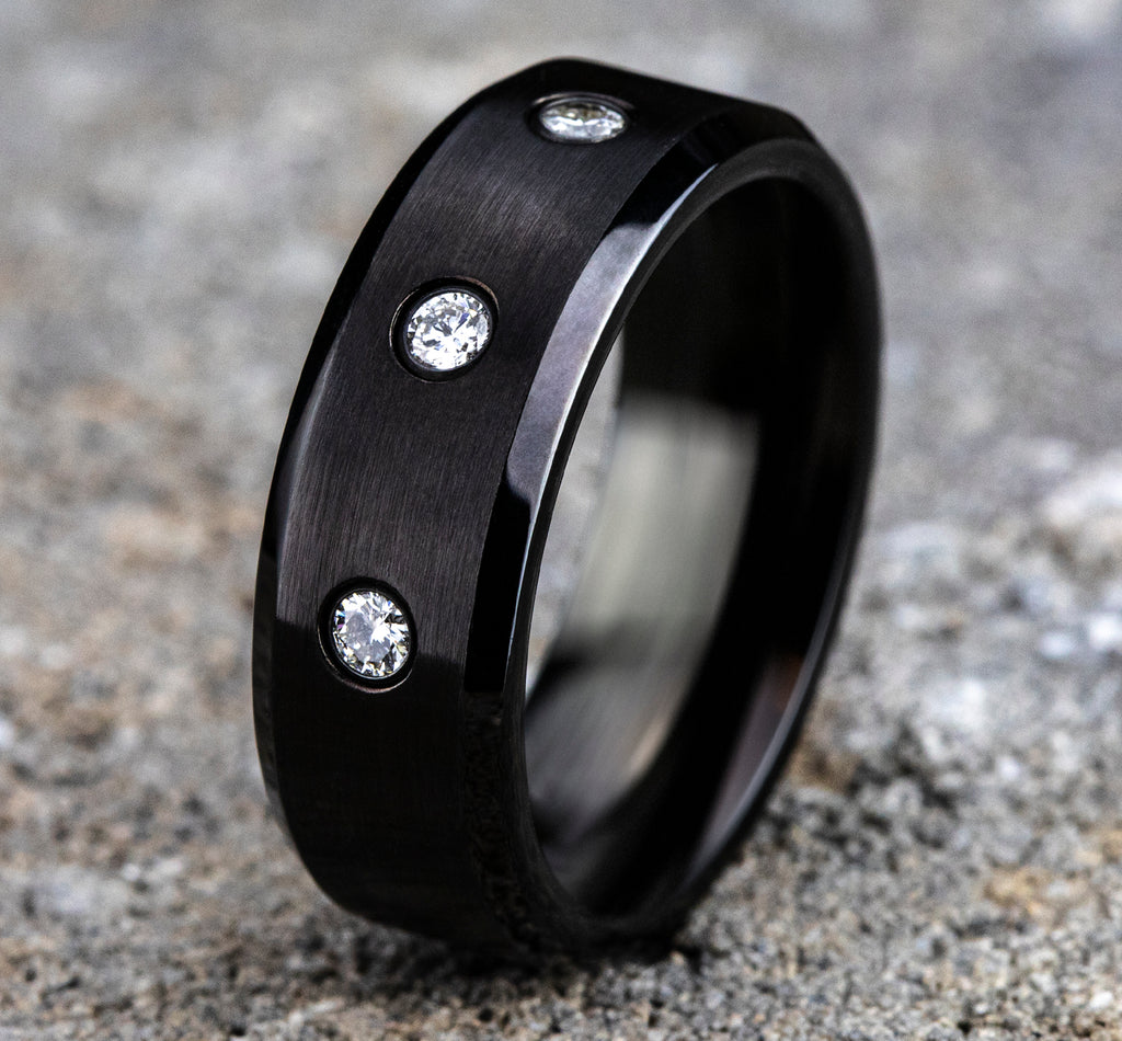 THE REAGAN 8mm, Comfort fit, Black Cobalt, Satin finish center, polished bevel edges, 3 burnish set diamonds , Carat weight is .18ct