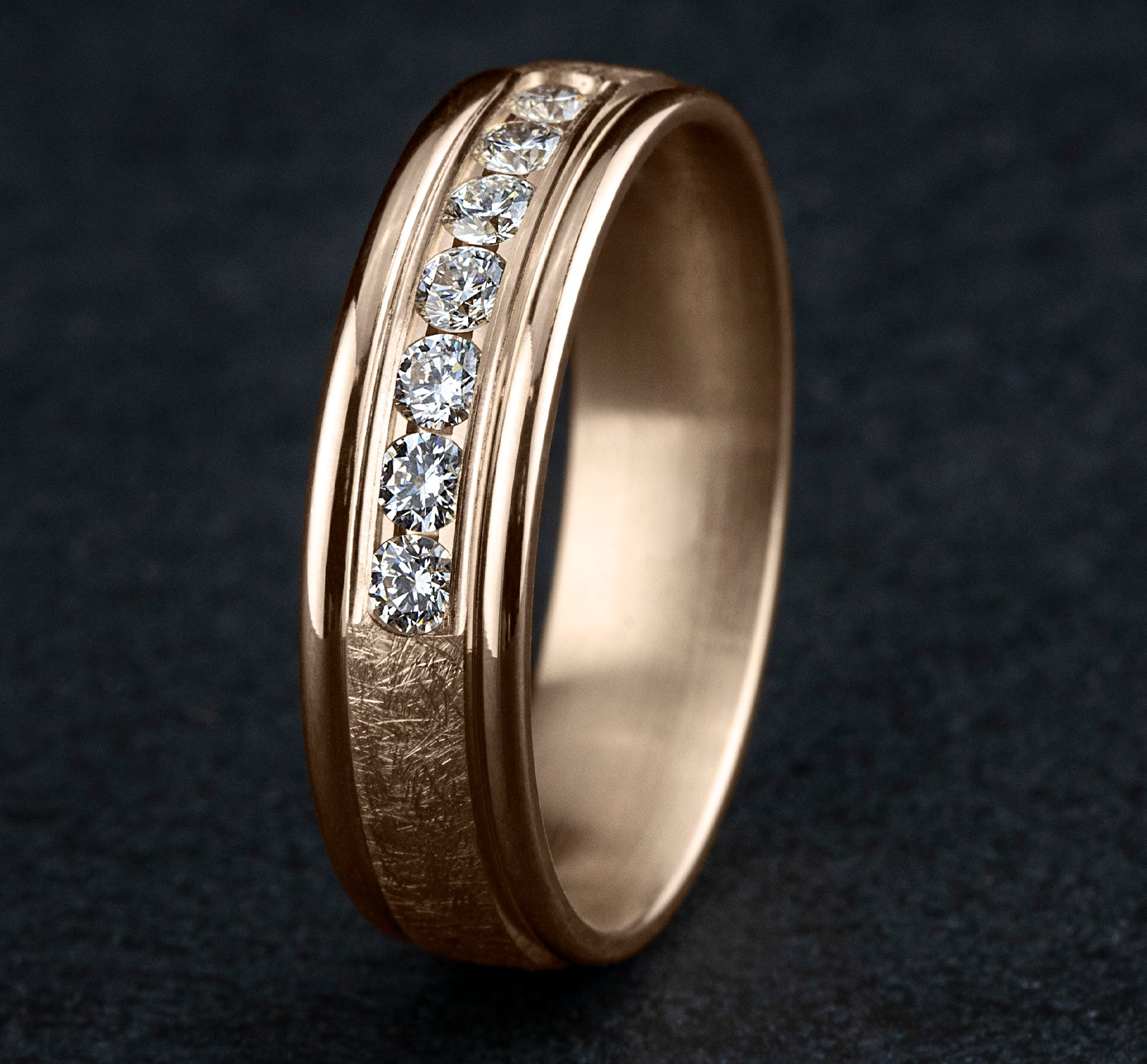 THE CAMBRIDGE 6.5mm, Comfort fit, 14K Rose Gold, Swirl finish, polished round edges, 7 channel set diamonds, Carat weight is .42ct, Clarity SI1-2, Color GH