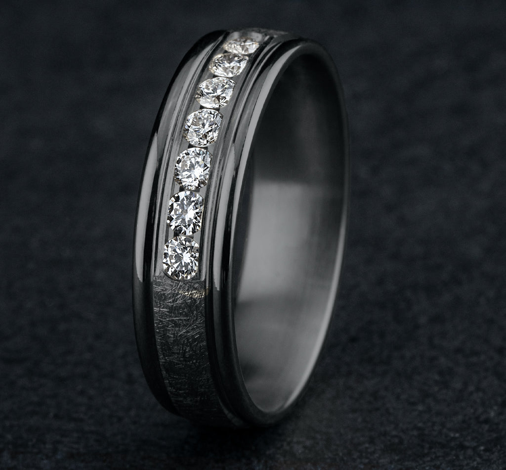 THE CAMBRIDGE 6.5mm, Comfort fit, Grey Tantalum, Swirl finish, polished round edges, 7 channel set diamonds, Carat weight is .42ct, Clarity SI1-2, Color GH